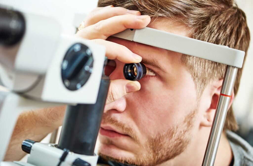 Young man getting eye exam from his optometrist