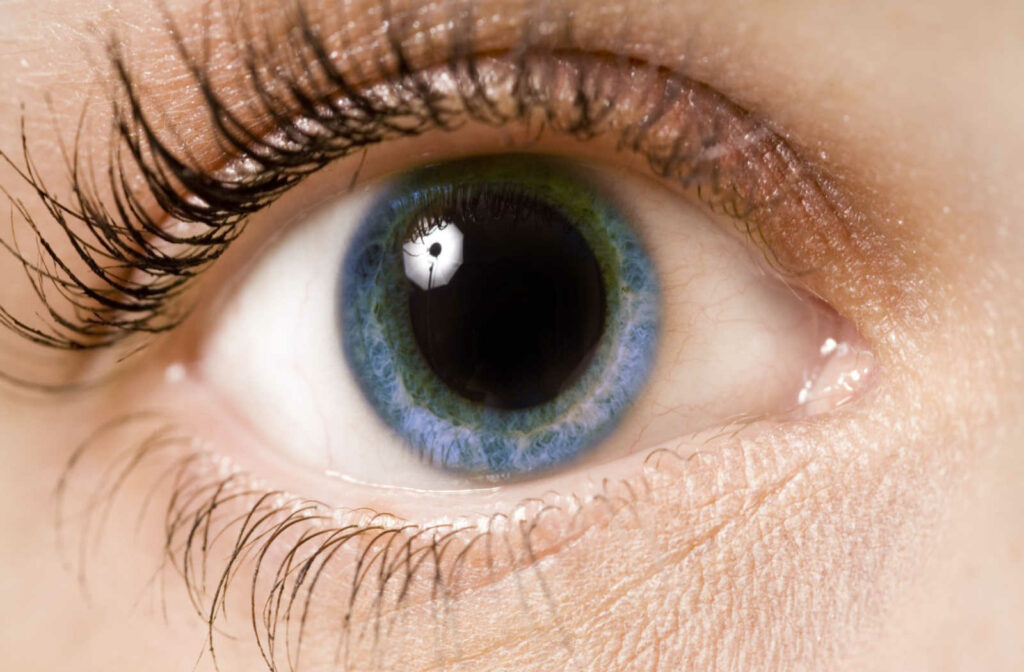 A close up of a dilated eye due to stress.
