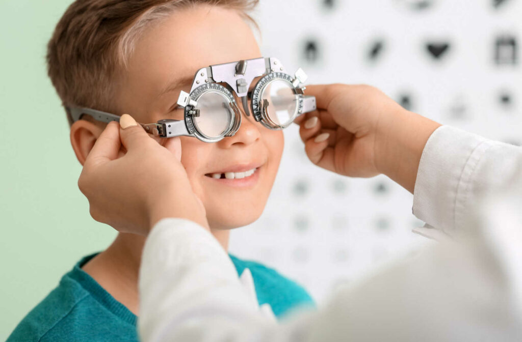 A young boy getting his eyes tested to determine if he is myopic