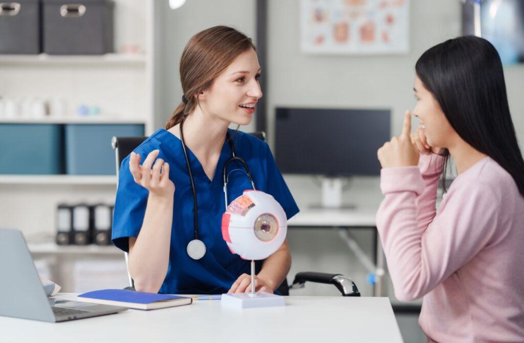 An optometrist explains the technology and design of ortho-k lenses to her patient.