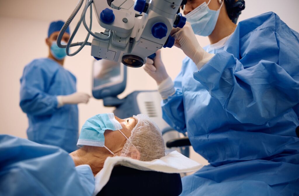 A patient is readied for cataract surgery in the operating room with her surgical team.