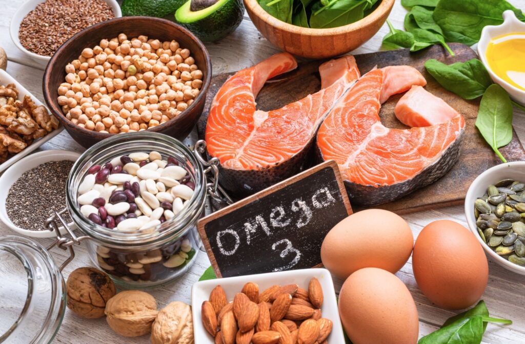 A spread of omega-3 fatty acid-rich foods with a chalkboard that says "Omega 3."