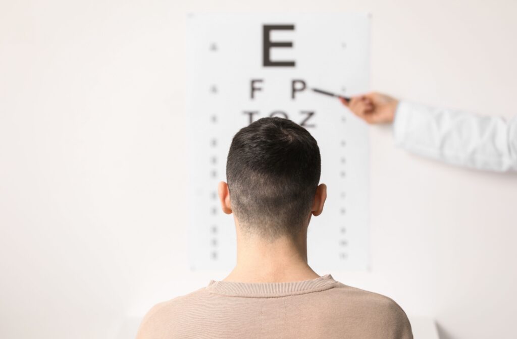 An adult at an eye exam testing for adult on-set myopia